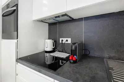 a kitchen with a coffee machine on a counter at Urban Style Apartments by Loft in Ljubljana