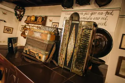 a group of antique items sitting on top of a table at Hotel in restavracija Pod Roglo in Zreče