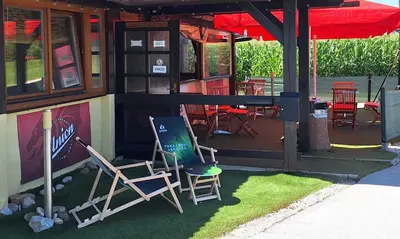 a couple of chairs sitting outside of a restaurant at Pri Ancki Sobe Rooms Accomodation Ljubljana suburbs in Medvode