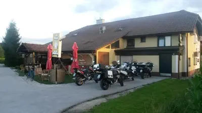 a group of motorcycles parked outside of a house at Pri Ancki Sobe Rooms Accomodation Ljubljana suburbs in Medvode
