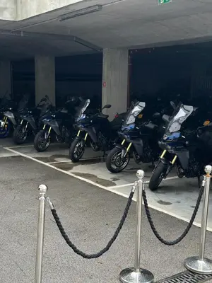 a group of motorcycles parked in a parking lot at Bled Rose Hotel in Bled