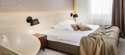 a hotel room with a bed and a sink at B&B Hotel Ljubljana Park in Ljubljana
