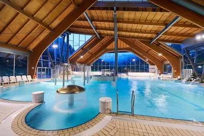 a large indoor swimming pool in a building at Eco Terme Snovik, Kamnik in Laze v Tuhinju