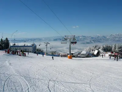 a group of people on a ski lift in the snow at Eco Terme Snovik, Kamnik in Laze v Tuhinju