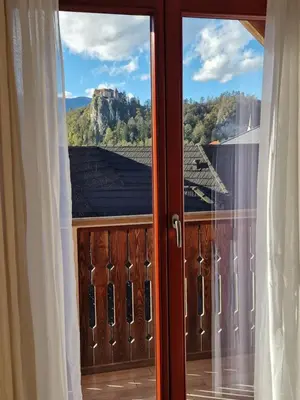 a window with a view of a mountain at Aparthotel Gaja in Bled