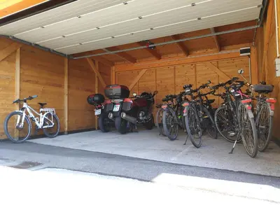 a group of bikes parked in a garage at Hotel Bau Maribor in Maribor