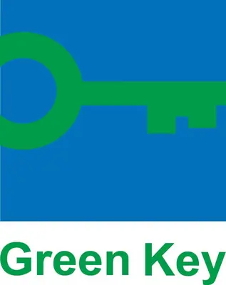 a green key with the words green key at Hotel Tabor Maribor in Maribor