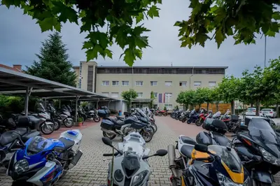 a row of motorcycles parked in front of a building at Hotel Tabor Maribor in Maribor