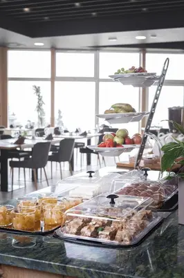 a buffet line with many different types of food at Grand Hotel BELLEVUE in Pohorje