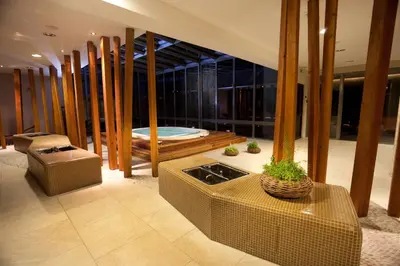 a large room with a bath tub and a room with at Hotel Astoria Superior in Bled