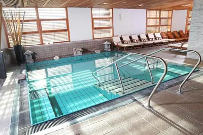 a large swimming pool with an empty at Hotel Kristal - Terme Krka in Dolenjske Toplice