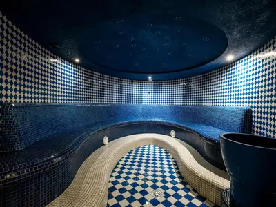a tunnel in a room with a tiled wall at Hotel Kristal - Terme Krka in Dolenjske Toplice