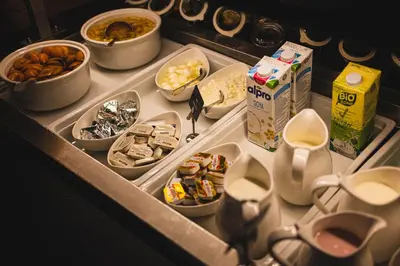 an open refrigerator filled with food and other foods at Hotel Sport - Terme Krka in Otočec