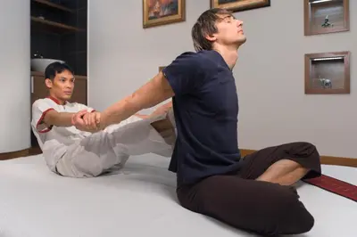 two men are sitting on the floor in a room at Terme Zrece - Hotel Vital in Zreče