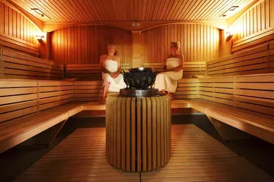 a couple of women sitting in a sauna at Hotel Radin, Radenci Spa Resort - Sava Hotels & Resorts in Radenci