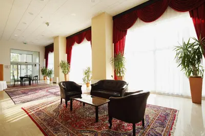 a lobby with a couch and chairs and a table at Hotel Radin, Radenci Spa Resort - Sava Hotels & Resorts in Radenci