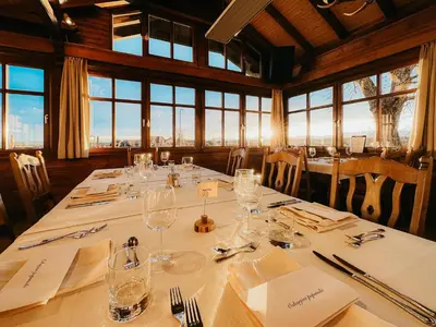 a dining room with a table with glasses on it at Hotel Oskar Zaplata in Preddvor