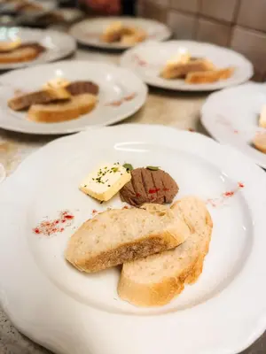 a plate of food with bread on a table at Hotel Oskar Zaplata in Preddvor