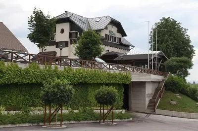 a house with ivy on the side of it at Hotel Oskar Zaplata in Preddvor