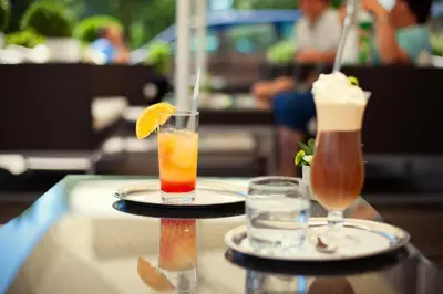 two drinks are sitting on a table at Hotel Creina in Kranj