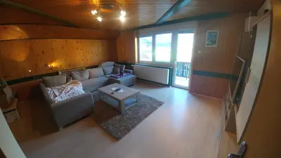 an overhead view of a living room with a couch and a table at Poldas apartments in Poljane nad Škofjo Loko