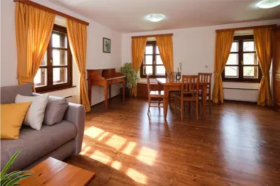 a living room with a couch and a table at Wine Grower's Mansion Zlati Gric in Slovenske Konjice