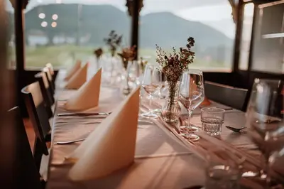a long table with wine glasses and napkins on it at Wine Grower's Mansion Zlati Gric in Slovenske Konjice