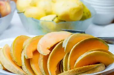 a pile of apples on a plate on a table at Grand Hotel Rogaska in Rogaška Slatina