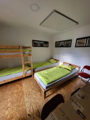 a room with two bunk beds in it at Bus Station Beds in Bled