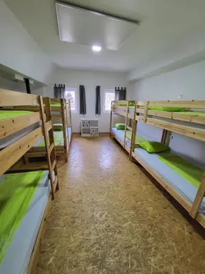 a group of bunk beds in a dorm room at Bus Station Beds in Bled