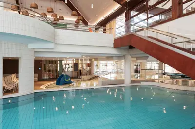 an indoor swimming pool with a large swimming pool at Hotel Termal - Terme 3000 - Sava Hotels & Resorts in Moravske Toplice