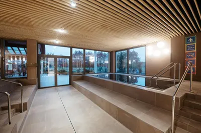 a large building with a swimming pool in a building at Hotel Ajda - Terme 3000 - Sava Hotels & Resorts in Moravske Toplice