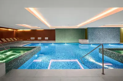 a large swimming pool in a hotel room at Perla, Resort & Entertainment in Nova Gorica