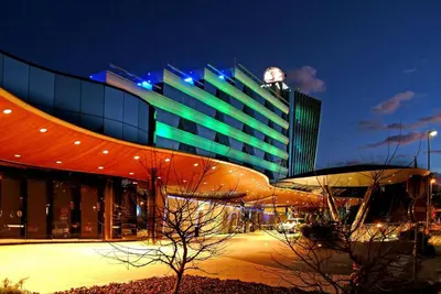 a large building with a clock on top of it at Perla, Resort & Entertainment in Nova Gorica