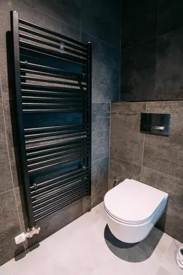 a bathroom with a white toilet in a room at Guest House Pohorska Kavarna in Maribor