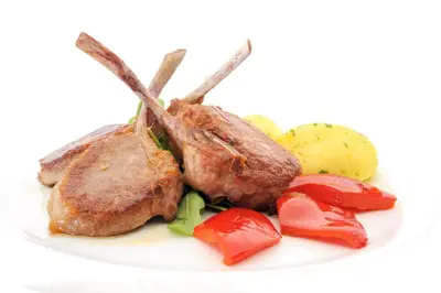 a plate of food with meat and vegetables on it at Park, Hotel & Entertainment in Nova Gorica
