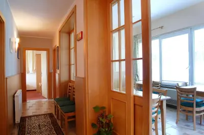 a hallway with a dining room and a table at Guest House Pri Gondoli in Maribor