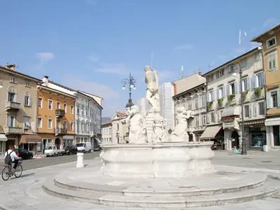 a large white statue in the middle of a street at Lipa, Hotel & Bistro in Nova Gorica
