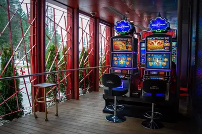 a row of slot machines in a room at Korona, Resort & Entertainment in Kranjska Gora