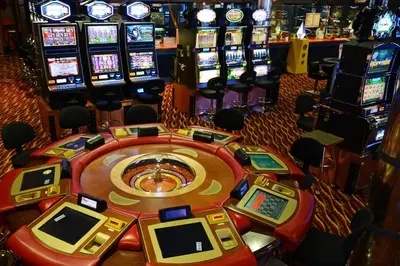 a casino with many slot machines in a casino at Korona, Resort & Entertainment in Kranjska Gora