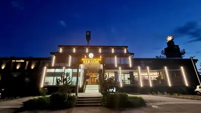 a building with a sign on the front of it at Hotel Faraon in Celje