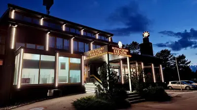 a building with a sign on the front of it at Hotel Faraon in Celje
