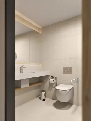 a bathroom with a toilet and a sink at Hotel Zdravilisce - Thermana Lasko in Laško