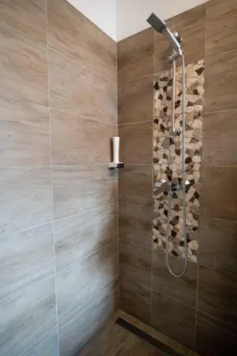 a bathroom with a shower with a glass door at Guesthouse Stari Mayr in Kranj