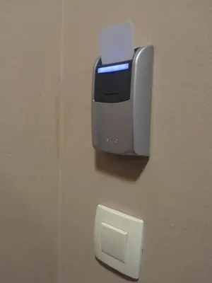 a soap dispenser on a wall next to a paper at Hotel Opara in Trebnje
