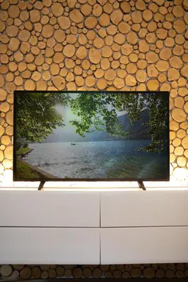 a television screen with a picture of a lake at Chalet Ana Bohinj in Bohinj
