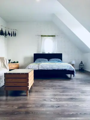 a bedroom with a bed and a window at Urban herbs apartment in Ljubljana