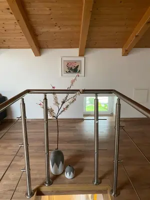 a vase with a plant in it in a room at Ciginj old stone house in Čiginj