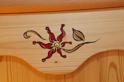 a painting of a spider on a wall at Kronau Chalet Resort in Kranjska Gora