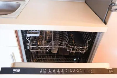 an oven with a dish rack inside of it at B8 apartment in Bohinj